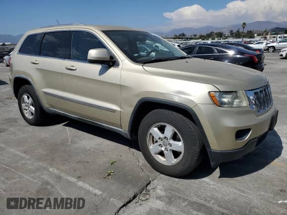 2012 Jeep Grand Cherokee Laredo z VIN 1C4RJEAG9CC177114, wystawiony jako Copart lot #70713065 z przebiegiem 105 759 mil mil oraz Czysty tytuł • Clean title. Historia ofert i sprzedaży dostępna na DreamBid. Obrazek 4.