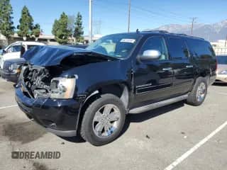 2013 Chevrolet Suburban LT with VIN 1GNSCJE06DR100546, listed as a Copart auction lot 86519335 with 192,147 mi miles and Salvage title. Bid and sale history available at DreamBid. Image 1.