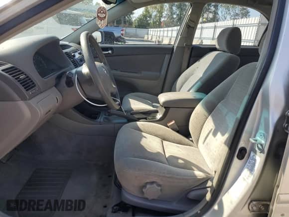 2002 Toyota Camry LE z VIN 4T1BE32K82U006520, wystawiony jako Copart lot #82041025 z przebiegiem 313 302 mil mil oraz Szkoda całkowita • Salvage title. Historia ofert i sprzedaży dostępna na DreamBid. Obrazek 7.