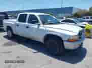 2003 Dodge Dakota SLT with VIN 1D7HL48N03S184534, listed as a IAAI auction lot 42423520 with 197,070 mi miles and . Bid and sale history available at DreamBid. Image 1.