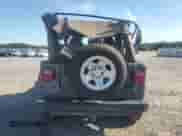 2002 Jeep Wrangler Sahara с VIN 1J4FA59S32P711205, выставлен на аукционе Copart как лот 70258405 с пробегом 117 004 миль миль и Списание • Salvage title. История ставок и продаж доступна на DreamBid. Изображение 6.