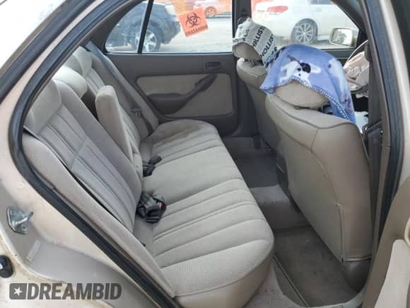 1995 Toyota Camry DX z VIN 4T1SK11E6SU553990, wystawiony jako Copart lot #68037885 z przebiegiem 195 488 mil mil oraz Szkoda całkowita • Salvage title. Historia ofert i sprzedaży dostępna na DreamBid. Obrazek 10.