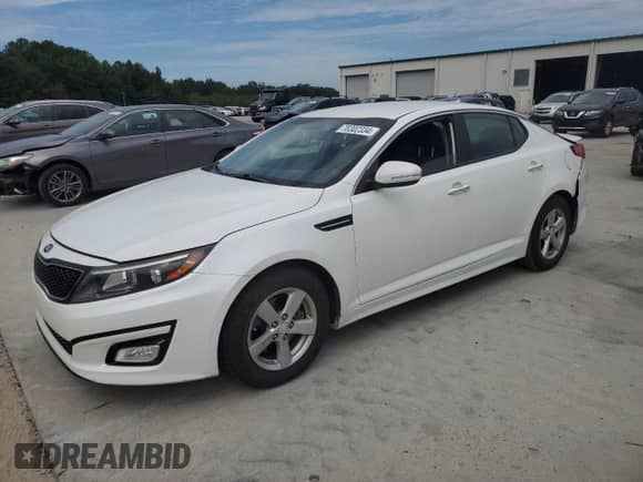 2015 Kia Optima LX with VIN KNAGM4A79F5630761, listed as a Copart auction lot 70302334 with 106,427 mi miles and Salvage title. Bid and sale history available at DreamBid. Image 1.