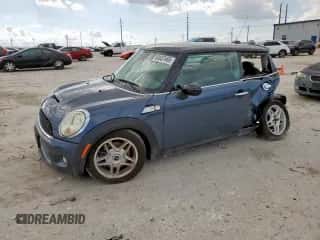 2010 MINI Hardtop S with VIN WMWMF7C51ATZ69061, listed as a Copart auction lot 60837465 with 102,506 mi miles and Salvage title. Bid and sale history available at DreamBid. Image 1.