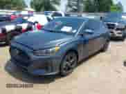 2019 Hyundai Veloster 2.0 z VIN KMHTG6AFXKU016745, wystawiony jako IAAI lot #42137343 z przebiegiem 90 095 mil mil oraz . Historia ofert i sprzedaży dostępna na DreamBid. Obrazek 2.