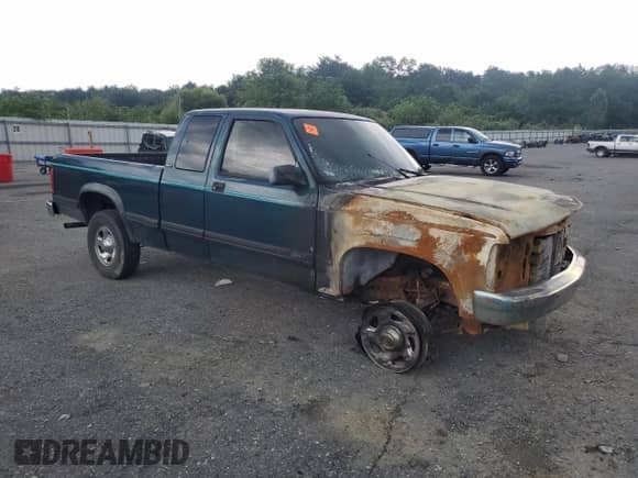 1994 Dodge Dakota z VIN 1B7GG23X0RW106473, wystawiony jako Copart lot #63375535 z przebiegiem Nie podano mil oraz Szkoda całkowita • Salvage title. Historia ofert i sprzedaży dostępna na DreamBid. Obrazek 4.