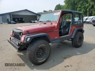 1998 Jeep Wrangler SE with VIN 1J4FY29P8WP714385, listed as a Copart auction lot 67436145 with 167,827 mi miles and Salvage title. Bid and sale history available at DreamBid. Image 1.