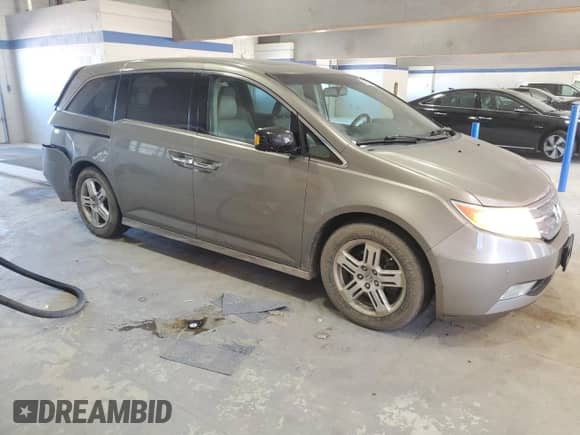 2012 Honda Odyssey Touring с VIN 5FNRL5H98CB078417, выставлен на аукционе Copart как лот 86089285 с пробегом 109 701 миль миль и Списание • Salvage title. История ставок и продаж доступна на DreamBid. Изображение 4.