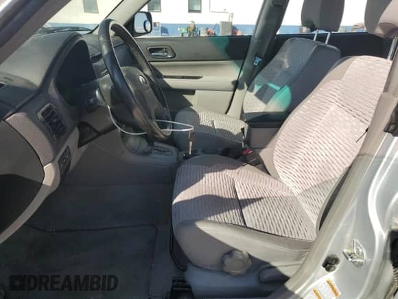 2004 Subaru Forester XS with VIN JF1SG65674H730022, listed as a Copart auction lot 71134505 with 157,196 mi miles and Salvage title. Bid and sale history available at DreamBid. Image 7.