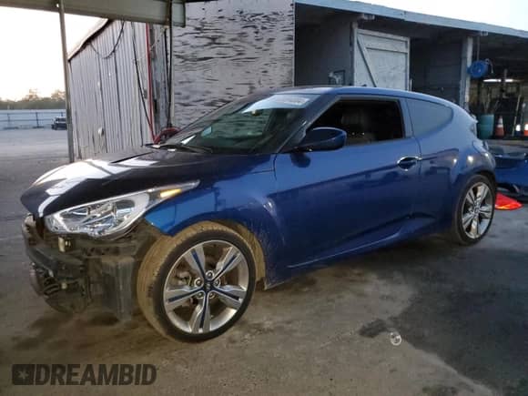 2016 Hyundai Veloster z VIN KMHTC6AD4GU302690, wystawiony jako Copart lot #83694004 z przebiegiem 150 846 mil mil oraz Szkoda całkowita • Salvage title. Historia ofert i sprzedaży dostępna na DreamBid. Obrazek 1.