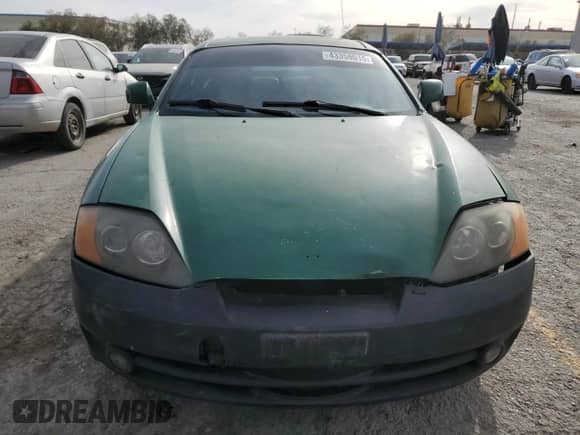 2004 Hyundai Tiburon GT с VIN KMHHN65F74U129996, выставлен на аукционе Copart как лот 43359015 с пробегом 231 277 миль миль и Списание • Salvage title. История ставок и продаж доступна на DreamBid. Изображение 5.
