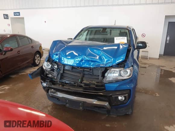 2021 Chevrolet Colorado 4WD Z71 z VIN 1GCGTDEN7M1141049, wystawiony jako IAAI lot #41223962 z przebiegiem 62 114 mil mil oraz . Historia ofert i sprzedaży dostępna na DreamBid. Obrazek 6.