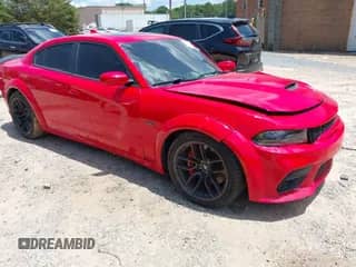 2021 Dodge Charger Scat Pack Widebody with VIN 2C3CDXGJ0MH598105, listed as a IAAI auction lot 42556999 with 82,253 mi miles and . Bid and sale history available at DreamBid. Image 1.
