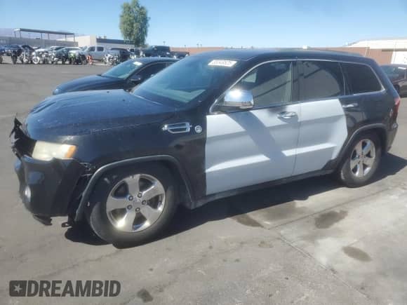 2012 Jeep Grand Cherokee Overland z VIN 1C4RJFCGXCC187959, wystawiony jako Copart lot #85349525 z przebiegiem 105 327 mil mil oraz Szkoda całkowita • Salvage title. Historia ofert i sprzedaży dostępna na DreamBid. Obrazek 1.
