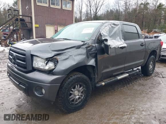 2013 Toyota Tundra with VIN 5TFDY5F18DX309798, listed as a IAAI auction lot 41711578 with 123,642 mi miles and . Bid and sale history available at DreamBid. Image 2.