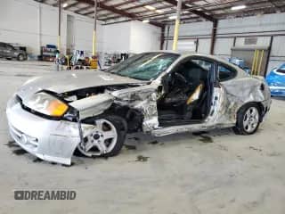 2004 Hyundai Tiburon GS z VIN KMHHM65D74U144595, wystawiony jako Copart lot #84241315 z przebiegiem 184 108 mil mil oraz Szkoda całkowita • Salvage title. Historia ofert i sprzedaży dostępna na DreamBid. Obrazek 1.