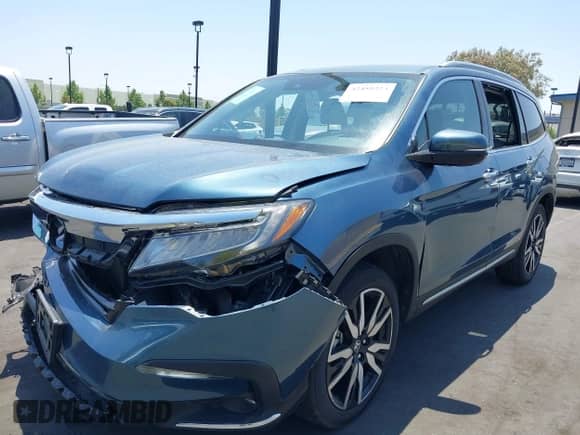 2021 Honda Pilot Touring 7-Passenger z VIN 5FNYF5H63MB039129, wystawiony jako IAAI lot #42455224 z przebiegiem Nie podano mil oraz . Historia ofert i sprzedaży dostępna na DreamBid. Obrazek 2.