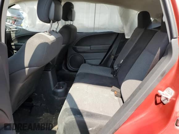 2010 Dodge Caliber Mainstreet z VIN 1B3CB3HA9AD642069, wystawiony jako Copart lot #67555465 z przebiegiem Nie podano mil oraz Szkoda całkowita • Salvage title. Historia ofert i sprzedaży dostępna na DreamBid. Obrazek 10.