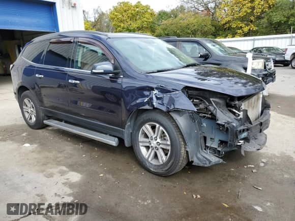 2015 Chevrolet Traverse LT with VIN 1GNKRHKD2FJ348129, listed as a Copart auction lot 85601495 with 102,579 mi miles and Salvage title. Bid and sale history available at DreamBid. Image 4.
