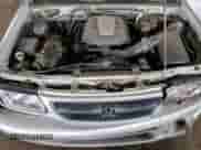 2000 Honda Passport LX with VIN 4S6CK58W6Y4409186, listed as a Copart auction lot 82193655 with 151,884 mi miles and Salvage title. Bid and sale history available at DreamBid. Image 12.