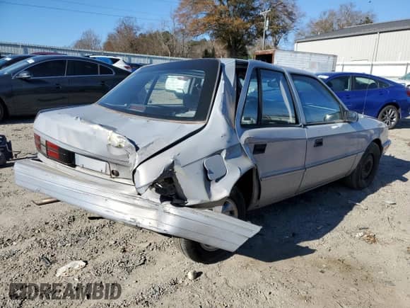 1994 Dodge Shadow with VIN 1B3AP28D5RN193704, listed as a Copart auction lot 82825004 with 90,223 mi miles and Salvage title. Bid and sale history available at DreamBid. Image 3.