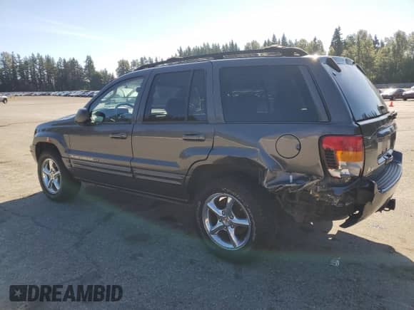 2002 Jeep Grand Cherokee Limited z VIN 1J8GW58J32C256389, wystawiony jako Copart lot #80217465 z przebiegiem 129 610 mil mil oraz Szkoda całkowita • Salvage title. Historia ofert i sprzedaży dostępna na DreamBid. Obrazek 2.