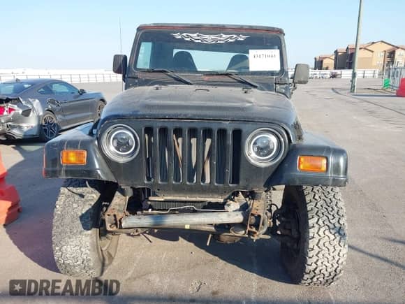2001 Jeep Wrangler Sport z VIN 1J4FA49S51P352240, wystawiony jako IAAI lot #43492638 z przebiegiem Nie podano mil oraz . Historia ofert i sprzedaży dostępna na DreamBid. Obrazek 6.