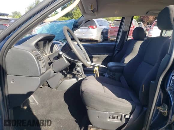 2002 Jeep Grand Cherokee Laredo with VIN 1J4GW48S82C128797, listed as a Copart auction lot 64885725 with 167,701 mi miles and Non repairable. Bid and sale history available at DreamBid. Image 7.