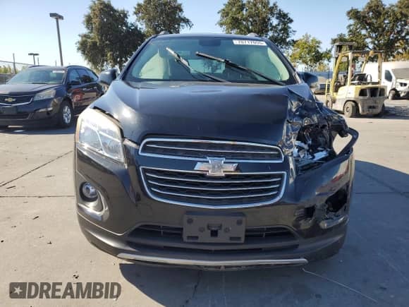 2015 Chevrolet Trax LTZ z VIN 3GNCJTSBXFL245658, wystawiony jako Copart lot #70717055 z przebiegiem 90 582 mil mil oraz Szkoda całkowita • Salvage title. Historia ofert i sprzedaży dostępna na DreamBid. Obrazek 5.