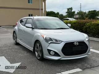 2014 Hyundai Veloster Turbo R-Spec с VIN KMHTC6AE1EU182840, выставлен на аукционе Copart как лот 80849145 с пробегом 56 852 миль миль и Чистый • Clean title. История ставок и продаж доступна на DreamBid. Изображение 1.