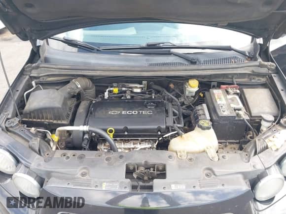 2014 Chevrolet Sonic LT z VIN 1G1JC5SH7E4137635, wystawiony jako IAAI lot #43083539 z przebiegiem 176 334 mil mil oraz . Historia ofert i sprzedaży dostępna na DreamBid. Obrazek 10.