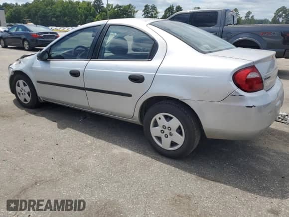 2003 Dodge Neon SE with VIN 1B3ES26C23D261772, listed as a Copart auction lot 70193335 with 181,827 mi miles and Salvage title. Bid and sale history available at DreamBid. Image 2.
