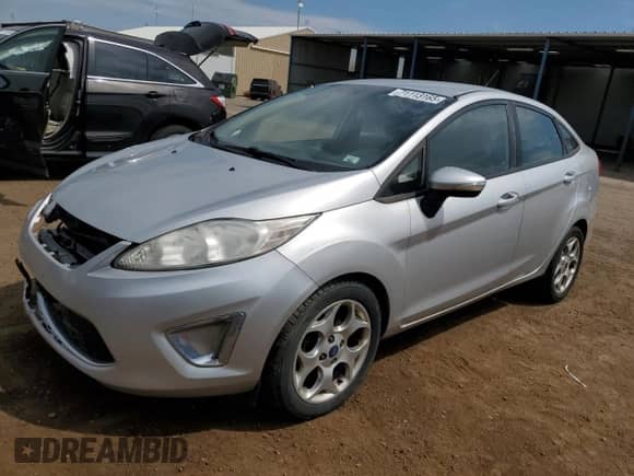 2011 Ford Fiesta SEL with VIN 3FADP4CJXBM217151, listed as a Copart auction lot 71113165 with 141,651 mi miles and Clean title. Bid and sale history available at DreamBid. Image 1.
