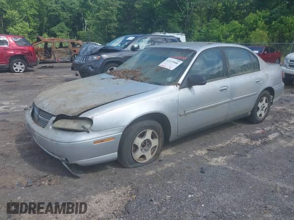 2004 Chevrolet Malibu Classic z VIN 1G1ND52F24M632174, wystawiony jako IAAI lot #42219900 z przebiegiem 250 912 mil mil oraz . Historia ofert i sprzedaży dostępna na DreamBid. Obrazek 2.