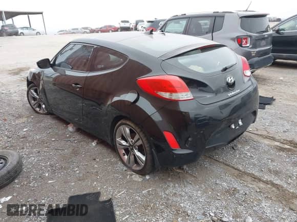 2014 Hyundai Veloster with VIN KMHTC6AD6EU182596, listed as a IAAI auction lot 41498382 with 99,376 mi miles and . Bid and sale history available at DreamBid. Image 3.