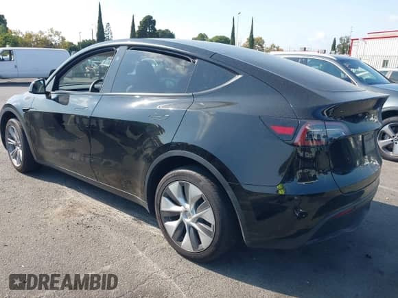 2023 Tesla Model Y Long Range z VIN 7SAYGAEE9PF851348, wystawiony jako IAAI lot #43167064 z przebiegiem Nie podano mil oraz . Historia ofert i sprzedaży dostępna na DreamBid. Obrazek 3.