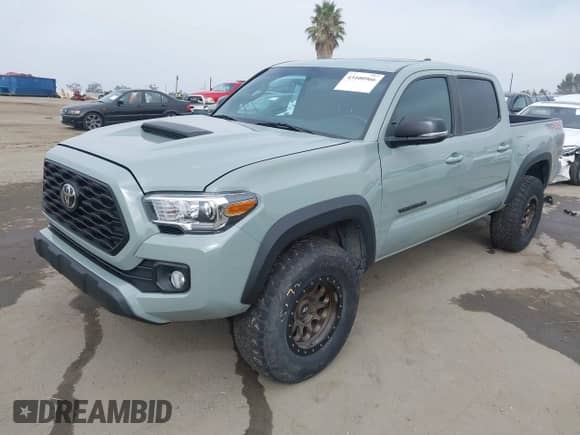 2023 Toyota Tacoma SR z VIN 3TMCZ5AN7PM543217, wystawiony jako IAAI lot #43400966 z przebiegiem 59 385 mil mil oraz . Historia ofert i sprzedaży dostępna na DreamBid. Obrazek 17.