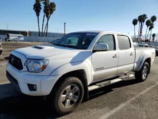 2014 Toyota Tacoma PreRunner with VIN 3TMKU4HN3EM040744, listed as a Copart auction lot 71853915 with 140,505 mi miles and Salvage title. Bid and sale history available at DreamBid. Image 1.