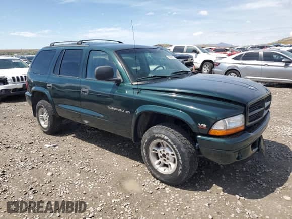 1999 Dodge Durango with VIN 1B4HS28Y4XF602018, listed as a Copart auction lot 55692175 with 135,058 mi miles and Salvage title. Bid and sale history available at DreamBid. Image 4.