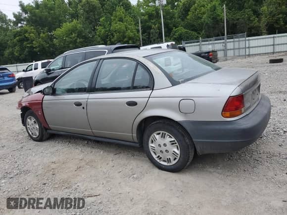 1999 Saturn SL с VIN 1G8ZH5284XZ272177, выставлен на аукционе Copart как лот 66902665 с пробегом 117 054 миль миль и Списание • Salvage title. История ставок и продаж доступна на DreamBid. Изображение 2.