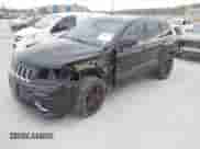 2015 Jeep Grand Cherokee SRT with VIN 1C4RJFDJXFC861770, listed as a IAAI auction lot 41698296 with 74,135 mi miles and . Bid and sale history available at DreamBid. Image 2.