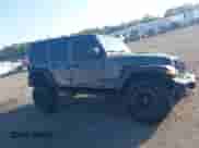 2022 Jeep Wrangler Unlimited Willys z VIN 1C4HJXDM9NW226080, wystawiony jako IAAI lot #43119592 z przebiegiem 59 039 mil mil oraz . Historia ofert i sprzedaży dostępna na DreamBid. Obrazek 13.