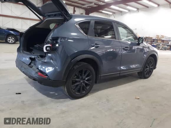 2025 Mazda CX-5 S Carbon Edition z VIN JM3KFBCM0S0599719, wystawiony jako Copart lot #64725555 z przebiegiem 3 501 mil mil oraz Szkoda całkowita • Salvage title. Historia ofert i sprzedaży dostępna na DreamBid. Obrazek 3.