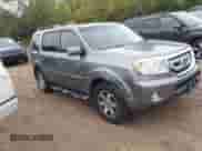 2009 Honda Pilot Touring with VIN 5FNYF48859B014722, listed as a IAAI auction lot 43277998 with 195,736 mi miles and . Bid and sale history available at DreamBid. Image 1.