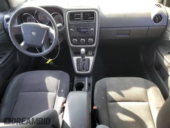 2010 Dodge Caliber SXT with VIN 1B3CB4HA3AD595658, listed as a Copart auction lot 85376495 with 209,626 mi miles and Salvage title. Bid and sale history available at DreamBid. Image 8.