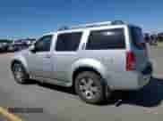 2011 Nissan Pathfinder LE z VIN 5N1AR1NB4BC630322, wystawiony jako Copart lot #64050515 z przebiegiem 251 886 mil mil oraz Szkoda całkowita • Salvage title. Historia ofert i sprzedaży dostępna na DreamBid. Obrazek 2.