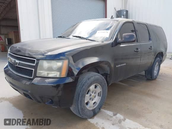 2013 Chevrolet Suburban LS with VIN 1GNSCHE02DR145217, listed as a IAAI auction lot 42794176 with 217,055 mi miles and . Bid and sale history available at DreamBid. Image 2.