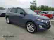 2018 Chevrolet Equinox Premier with VIN 3GNAXVEV7JL174306, listed as a Copart auction lot 60219475 with 80,679 mi miles and Salvage title. Bid and sale history available at DreamBid. Image 4.