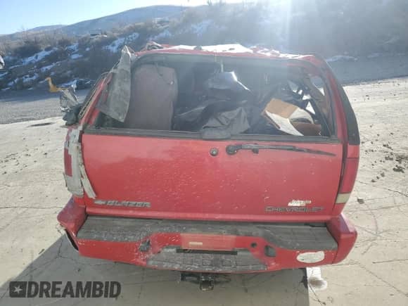 2001 Chevrolet Blazer LS z VIN 1GNCT18W21K218859, wystawiony jako Copart lot #88841755 z przebiegiem Nie podano mil oraz Nie do naprawy • Non repairable. Historia ofert i sprzedaży dostępna na DreamBid. Obrazek 6.