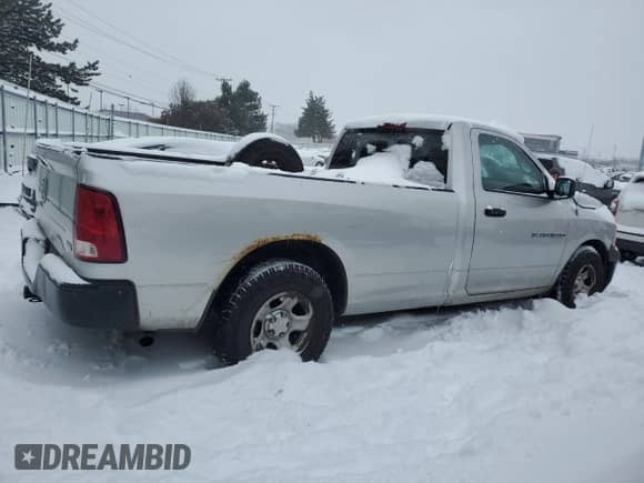 2012 Ram 1500 ST z VIN 3C6JD6DP2CG207886, wystawiony jako Copart lot #41557525 z przebiegiem 246 807 mil mil oraz Szkoda całkowita • Salvage title. Historia ofert i sprzedaży dostępna na DreamBid. Obrazek 3.